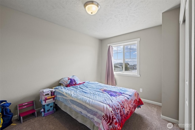301 K St NE, Quincy, WA 98848 - carpeted bedroom featuring baseboards and a textured ceiling