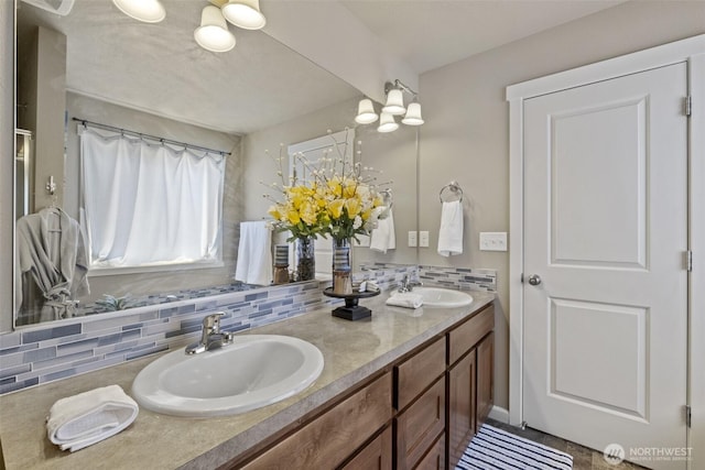 301 K St NE, Quincy, WA 98848 - bathroom with double vanity and decorative backsplash