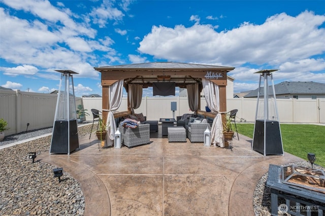 301 K St NE, Quincy, WA 98848 - fenced backyard featuring a gazebo, an outdoor living space with a fire pit, and a patio area