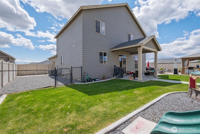 301 K St NE, Quincy, WA 98848 - rear view of house with a gate, a patio, a gazebo, and an outdoor living space