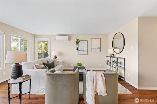 1965 12th Ave W Unit 202, Seattle, WA 98119 - living room with wood finished floors, an AC wall unit, and baseboards