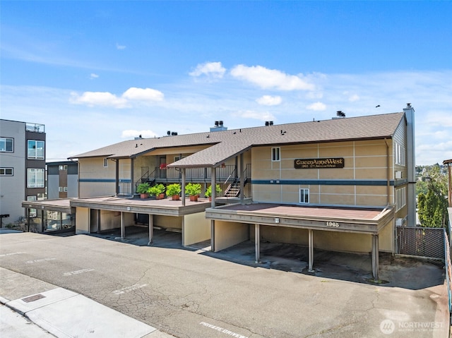 1965 12th Ave W Unit 202, Seattle, WA 98119 - rear view of property with covered parking