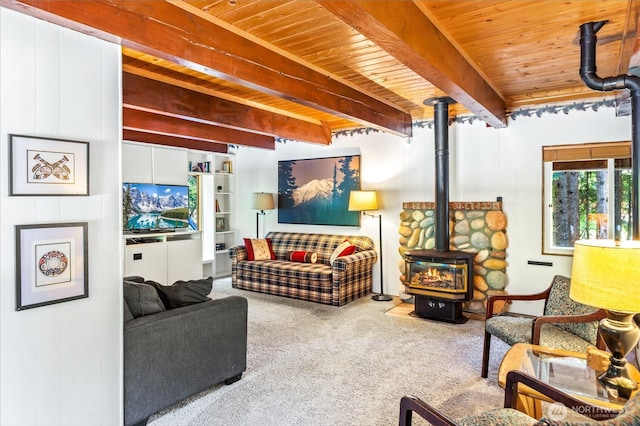 11318 583rd Ave E, Enumclaw, WA 98022 - living room with a wood stove, carpet flooring, and wooden ceiling with exposed beams