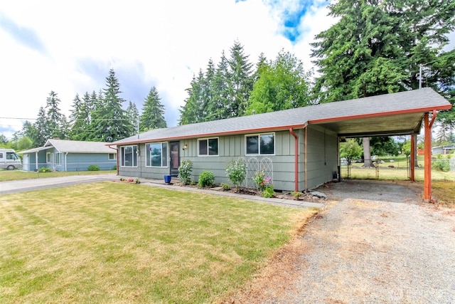 13812 Golden Given Rd E, Tacoma, WA 98445 - single story home featuring asphalt driveway, an attached carport, and board and batten siding