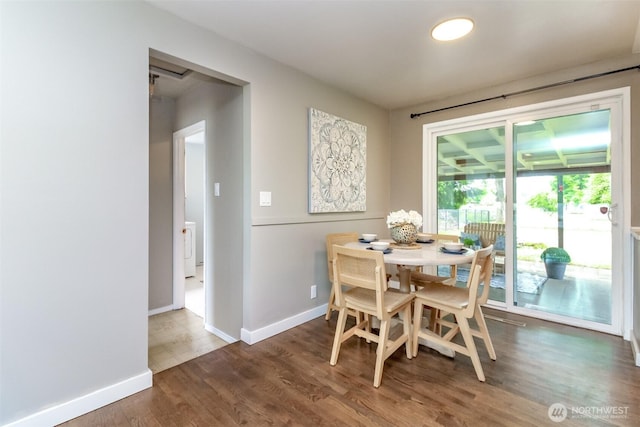13812 Golden Given Rd E, Tacoma, WA 98445 - dining area with baseboards, wood finished floors, and washer / dryer