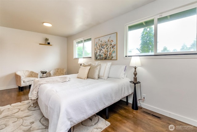 13812 Golden Given Rd E, Tacoma, WA 98445 - bedroom with wood finished floors and baseboards