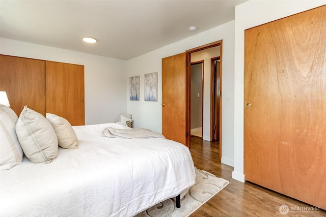 13812 Golden Given Rd E, Tacoma, WA 98445 - bedroom featuring wood finished floors and baseboards