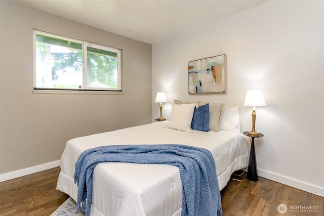 13812 Golden Given Rd E, Tacoma, WA 98445 - bedroom featuring baseboards and wood finished floors