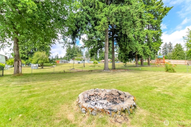 13812 Golden Given Rd E, Tacoma, WA 98445 - view of yard with a playground and a fire pit