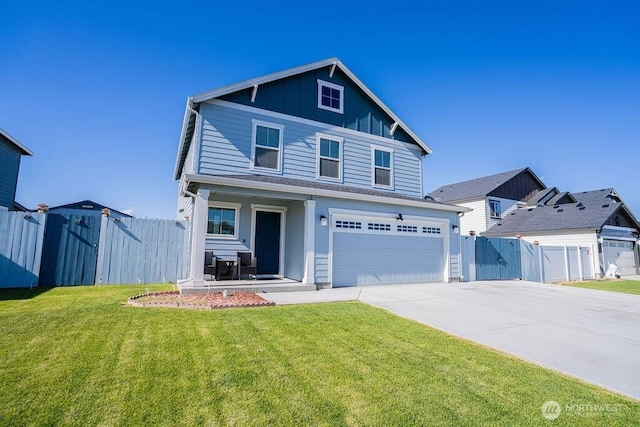 733 K St NE, Quincy, WA 98848 - traditional-style home with board and batten siding, an attached garage, driveway, and a gate