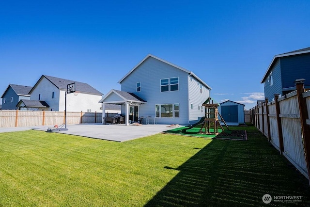 733 K St NE, Quincy, WA 98848 - back of house with a patio and a playground