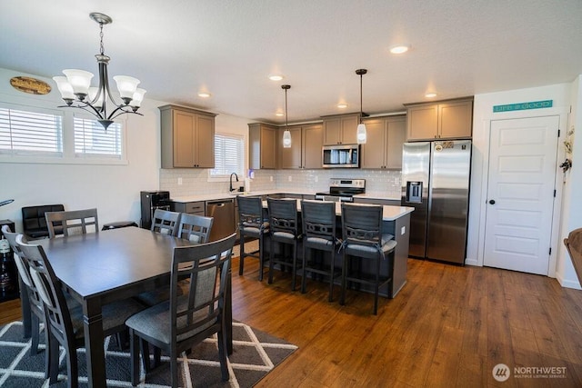 733 K St NE, Quincy, WA 98848 - dining room featuring dark wood-style flooring, a chandelier, and recessed lighting