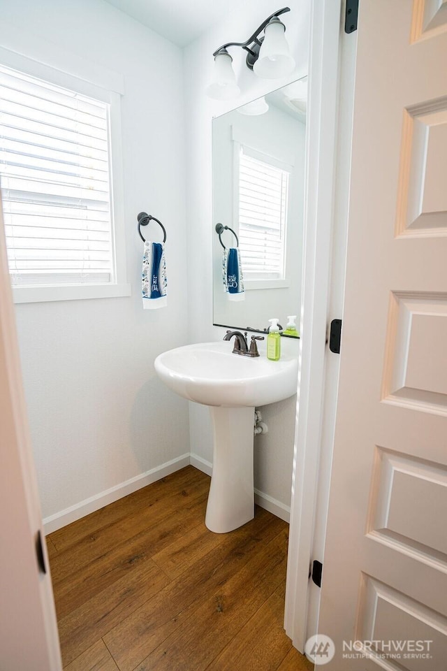 733 K St NE, Quincy, WA 98848 - bathroom with wood finished floors, baseboards, and healthy amount of natural light