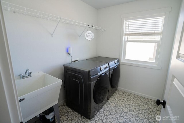733 K St NE, Quincy, WA 98848 - washroom with washing machine and dryer and baseboards