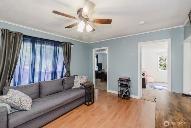 2395 SE Salmonberry Rd, Port Orchard, WA 98366 - living room with a ceiling fan, wood finished floors, crown molding, and baseboards