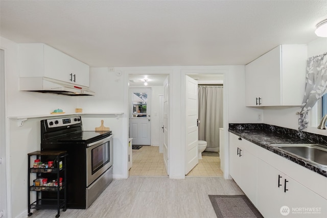 2395 SE Salmonberry Rd, Port Orchard, WA 98366 - kitchen featuring stainless steel range with electric stovetop, under cabinet range hood, a sink, and white cabinetry