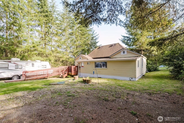 2395 SE Salmonberry Rd, Port Orchard, WA 98366 - rear view of house with a wooden deck and a yard