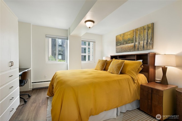 1200 Boylston Ave Unit 505, Seattle, WA 98101 - bedroom featuring a baseboard heating unit and wood finished floors