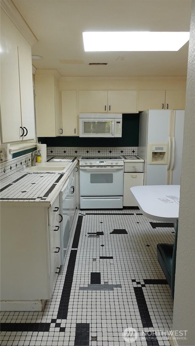 4635 N Defiance St, Tacoma, WA 98407 - kitchen featuring white appliances, tasteful backsplash, and white cabinets