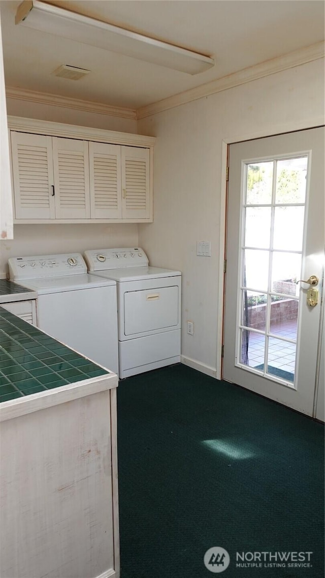 4635 N Defiance St, Tacoma, WA 98407 - laundry area featuring separate washer and dryer, crown molding, cabinet space, dark colored carpet, and baseboards