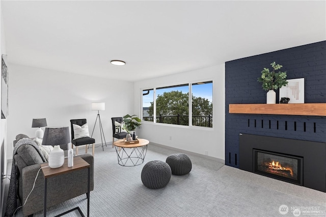 1345 Rainbow Ln, Camano Island, WA 98282 - carpeted living area featuring a large fireplace and baseboards