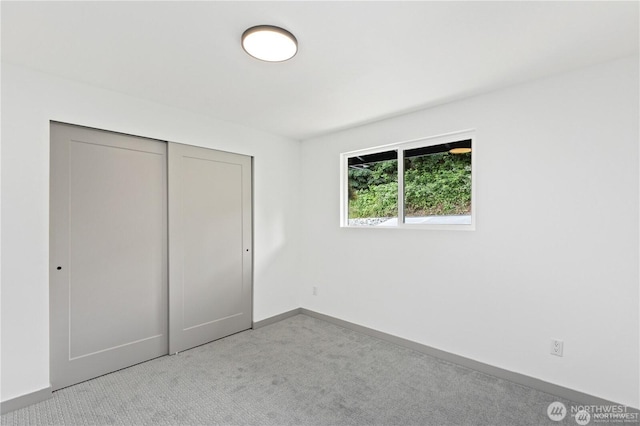 1345 Rainbow Ln, Camano Island, WA 98282 - unfurnished bedroom with carpet flooring, a closet, and baseboards