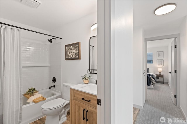 1345 Rainbow Ln, Camano Island, WA 98282 - bathroom featuring vanity, shower / bath combination with curtain, toilet, baseboards, and ensuite bathroom