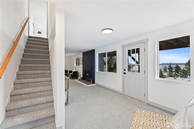 1345 Rainbow Ln, Camano Island, WA 98282 - entrance foyer with carpet floors, stairway, and plenty of natural light