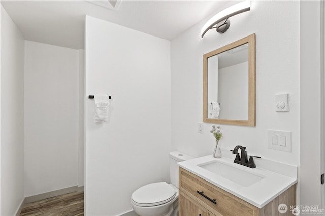 1345 Rainbow Ln, Camano Island, WA 98282 - bathroom featuring vanity, toilet, and wood finished floors