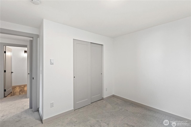 1345 Rainbow Ln, Camano Island, WA 98282 - unfurnished bedroom with carpet floors, baseboards, and a closet