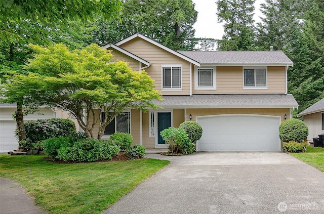 821 Sarah Ct NW, Olympia, WA 98502 - view of front facade featuring a garage, driveway, roof with shingles, and a front lawn