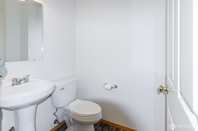 821 Sarah Ct NW, Olympia, WA 98502 - bathroom with toilet, wood finished floors, and baseboards