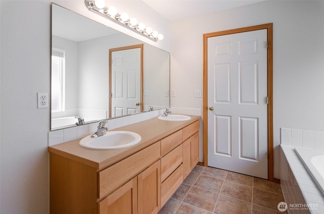 821 Sarah Ct NW, Olympia, WA 98502 - bathroom featuring double vanity, tiled tub, and tile patterned floors