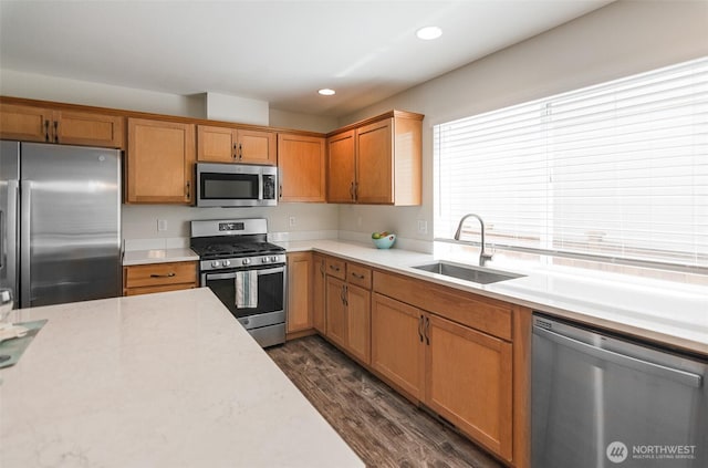 821 Sarah Ct NW, Olympia, WA 98502 - kitchen featuring appliances with stainless steel finishes, a sink, light countertops, dark wood-style flooring, and recessed lighting