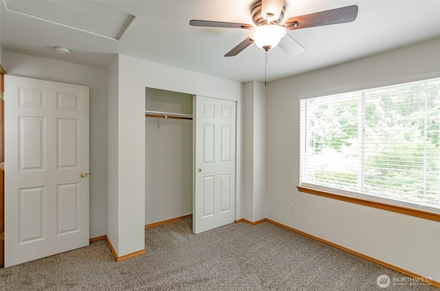 821 Sarah Ct NW, Olympia, WA 98502 - unfurnished bedroom with light colored carpet, baseboards, a closet, and a ceiling fan