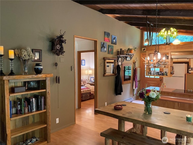 291 Williams Rd, Ariel, WA 98603 - dining area with a chandelier, wood finished floors, and wooden ceiling with exposed beams