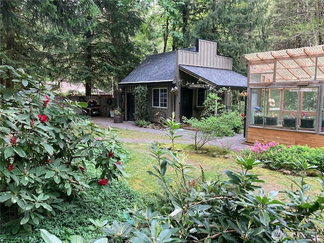 291 Williams Rd, Ariel, WA 98603 - back of house with a shingled roof, an outbuilding, and a greenhouse