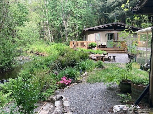 291 Williams Rd, Ariel, WA 98603 - view of yard featuring a wooden deck and a forest view