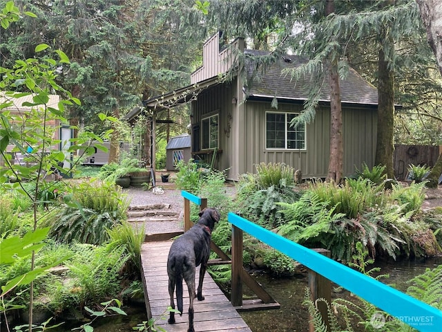 291 Williams Rd, Ariel, WA 98603 - rear view of property with board and batten siding and roof with shingles