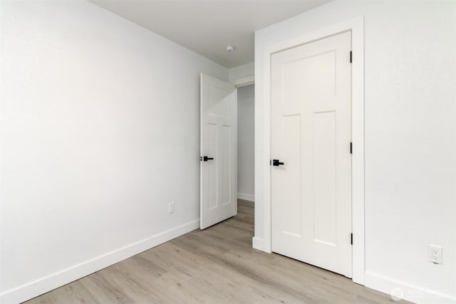 5611 S Cheyenne St, Tacoma, WA 98409 - unfurnished bedroom featuring light wood-style flooring and baseboards