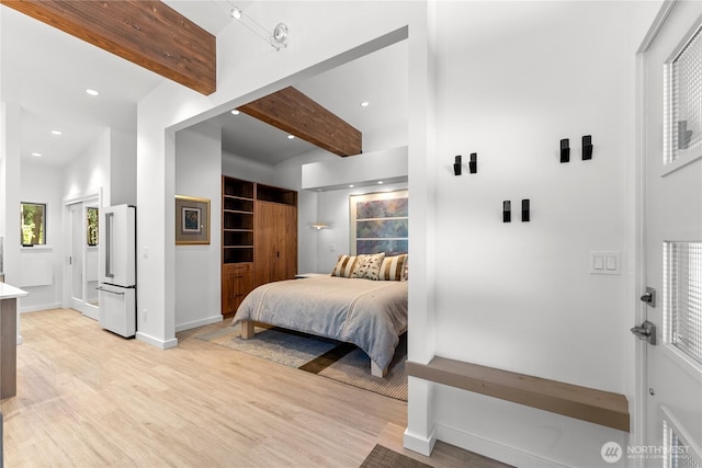 19 Davelaar Dr, Mazama, WA 98833 - bedroom featuring high end white refrigerator, beamed ceiling, light wood-type flooring, recessed lighting, and baseboards
