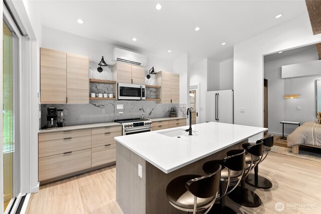 19 Davelaar Dr, Mazama, WA 98833 - kitchen featuring white appliances, a sink, modern cabinets, light brown cabinets, and recessed lighting