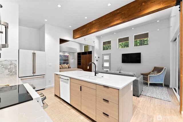 19 Davelaar Dr, Mazama, WA 98833 - kitchen featuring white appliances, light brown cabinetry, a sink, open floor plan, and light wood-style flooring