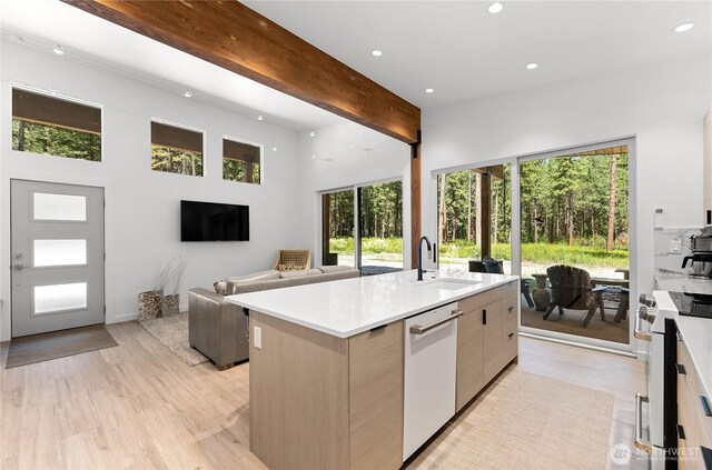19 Davelaar Dr, Mazama, WA 98833 - kitchen with white appliances, a sink, modern cabinets, beamed ceiling, and recessed lighting