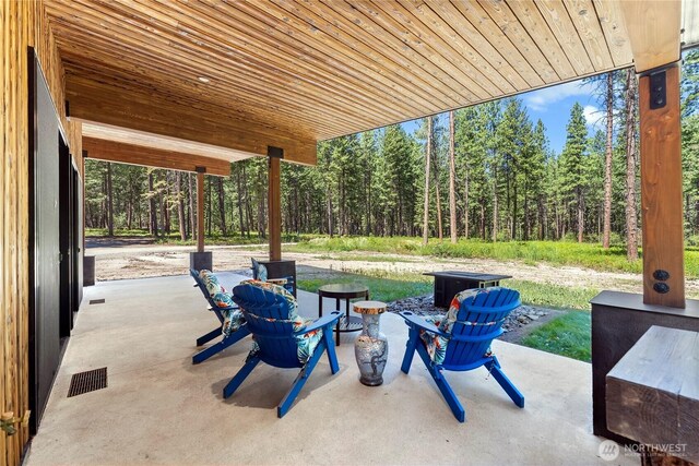 19 Davelaar Dr, Mazama, WA 98833 - view of patio / terrace with a wooded view