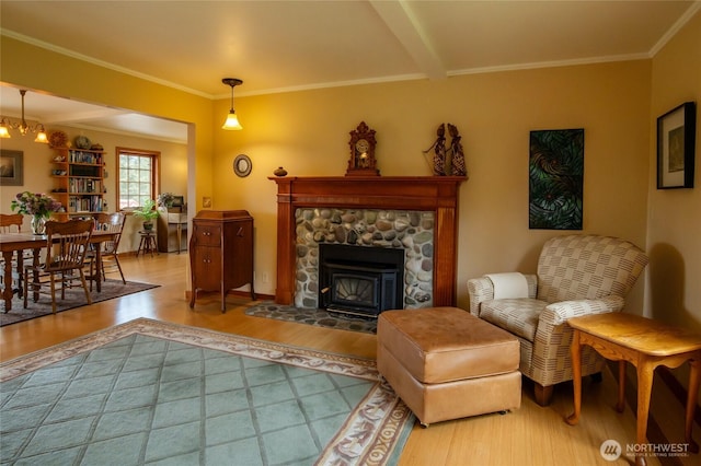 472 Redtail Ln, Lopez Island, WA 98261 - living room with wood finished floors, crown molding, and a stone fireplace