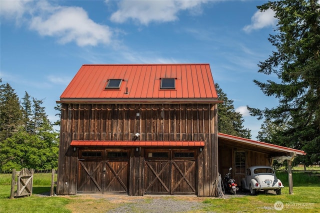 472 Redtail Ln, Lopez Island, WA 98261 - view of front of house featuring metal roof, a standing seam roof, board and batten siding, and a front yard