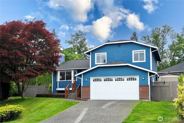 2 199th Pl SE, Bothell, WA 98012 - split level home with brick siding, driveway, and a garage