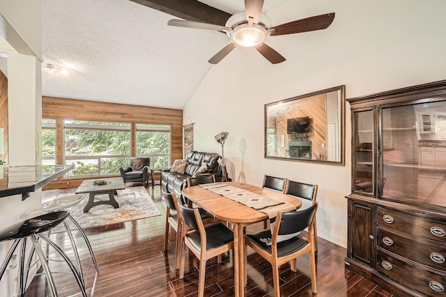 2617 35th Ave SE, Puyallup, WA 98374 - dining space with lofted ceiling, a ceiling fan, dark wood-style floors, and a textured ceiling