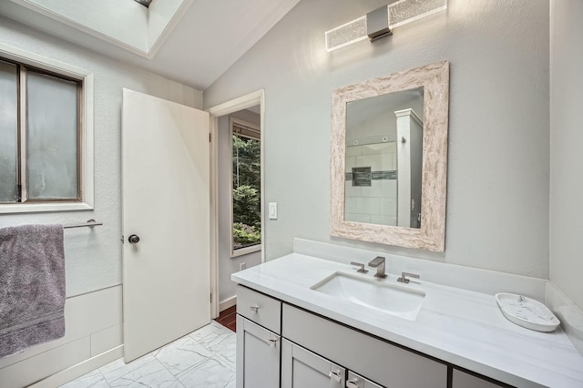 2617 35th Ave SE, Puyallup, WA 98374 - full bath with lofted ceiling, vanity, marble finish floors, and a shower